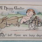 1915 Easter Postcard Rabbit Pulling Wagon of Eggs Baby Posted Divided