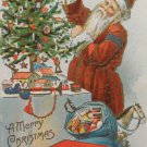 Antique Christmas Postcard Santa Claus Fixing a Christmas Tree Embossed Posted