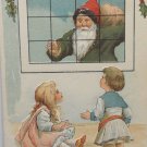 Antique Christmas Postcard Santa Claus Dressed in Gray Shirt with Red Hat