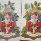 Two Antique Christmas Postcards Santa Claus on a Bell Posted Divided Embossed