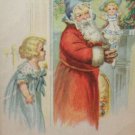 Antique Christmas postcard Santa Claus Wearing Red Coat with Blue Hat Has a Doll