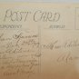 Antique Christmas postcard Santa Claus Wearing Red Coat with Blue Hat Has a Doll