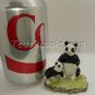 Pandas with a bad paint job. (figurine)
