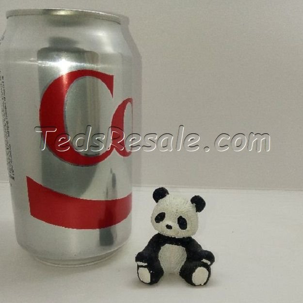 Little panda sitting by himself. (figurine)
