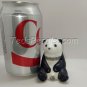 Beautiful little Panda sitting on his bum. (figurine)