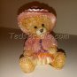 Cute little Momma bear dressed up in pink.  (figurine)