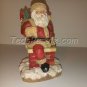 Santa in top of Chimney with bag of toys (figurine)