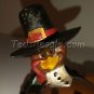 Stupid-looking Turkey Sitting on his Backside. (figurine)