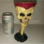 Skeleton Hand Holding Up a Skull Head Goblet