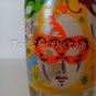Masks on a Drinking Glass