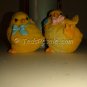 Two little Yellow Chickies with blue and pink bows (figurines)