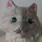 Kitty with bad eye, shelf figurine.