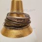 A Group of 22 Shades of Darkened Silver color Stacking Bracelets