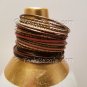 A Group of 23 Shades of Pink and Gold Stacking Bracelets