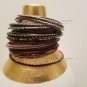 A Group of 34 Shades of Purple and Pink Stacking Bracelets