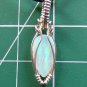 lab created opal wrapped in sterling silver