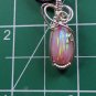 lab created opal wrapped in sterling silver