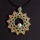 gold and green beaded pendant
