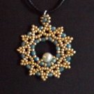 gold and light blue beaded pendant