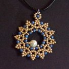 gold and metallic blue beaded pendant
