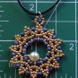 gold and metallic blue beaded pendant