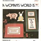 a woman's world is ... to cross stitch