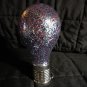 Light up Plastic Bulb with Glitter inside. Solar powered. On and Off switch inside bottom