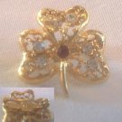 GOLD SHAMROCK BROOCH WITH CRYSTAL & RED STONES