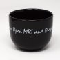 Black Coffee Mug with White Script Logo from Champion Open MRI and Diagnostic Center