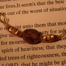 Raku with copper bead necklace