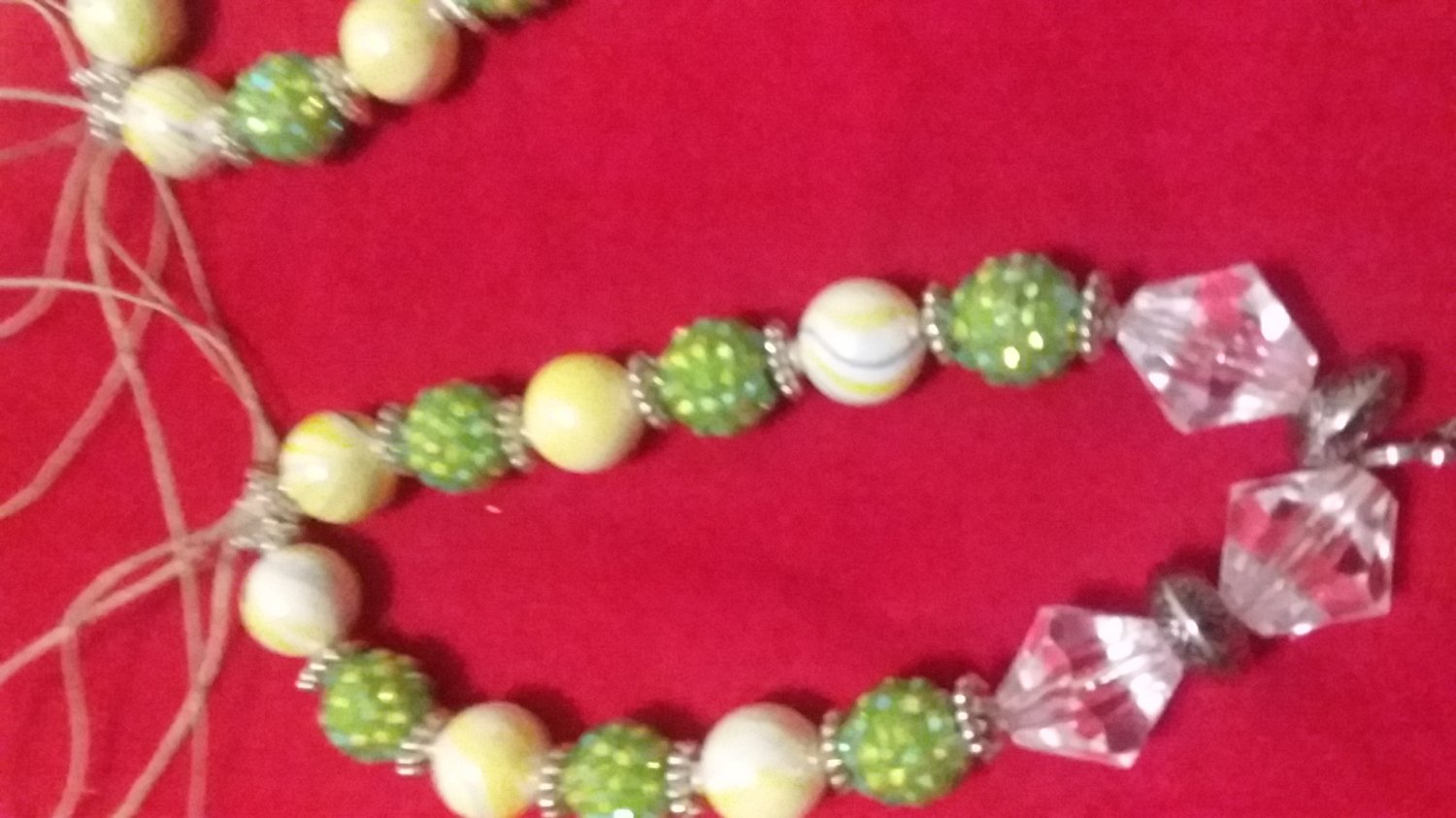 Green and metal glass bead keychain