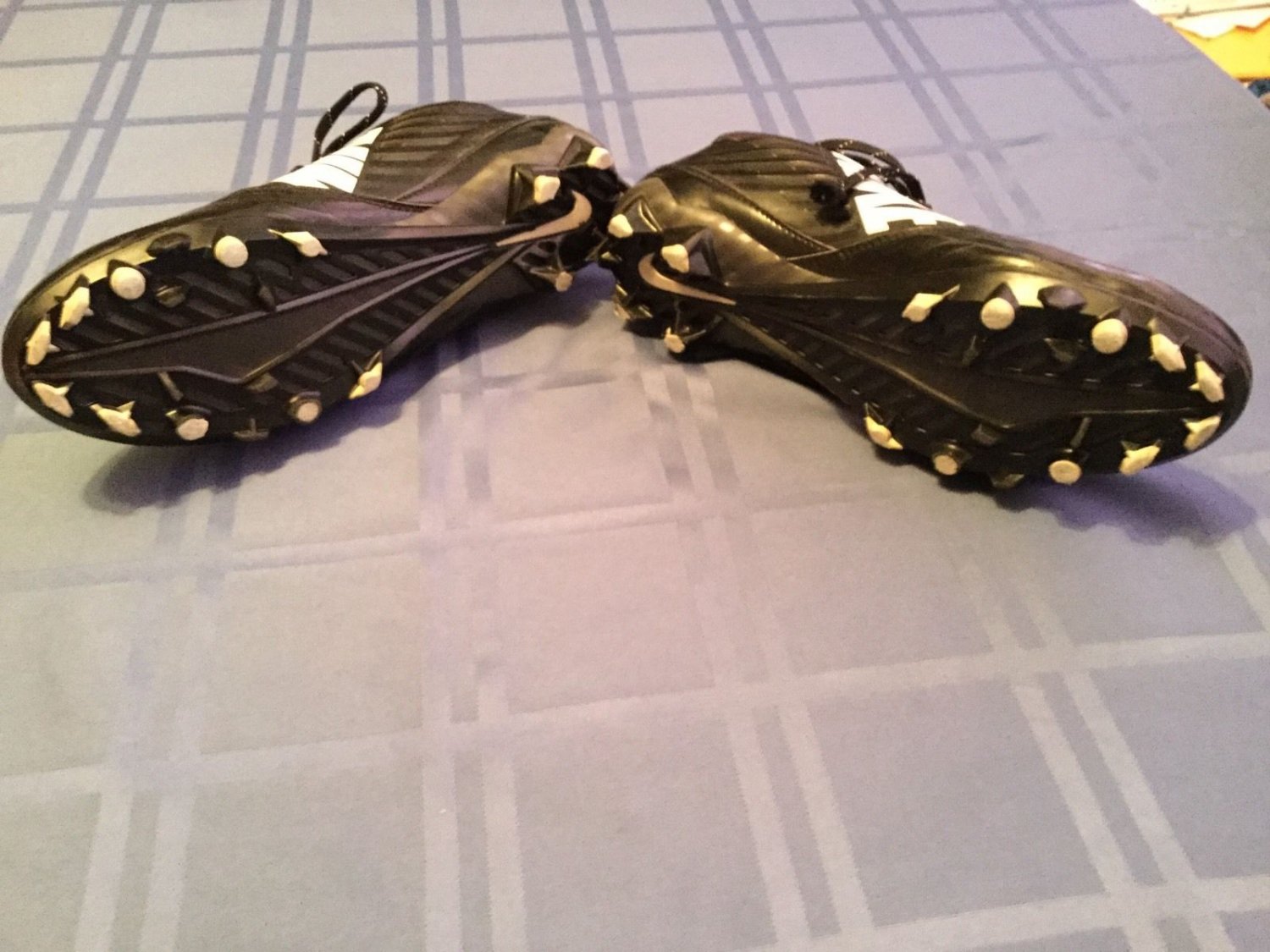 black and white vapor cleats