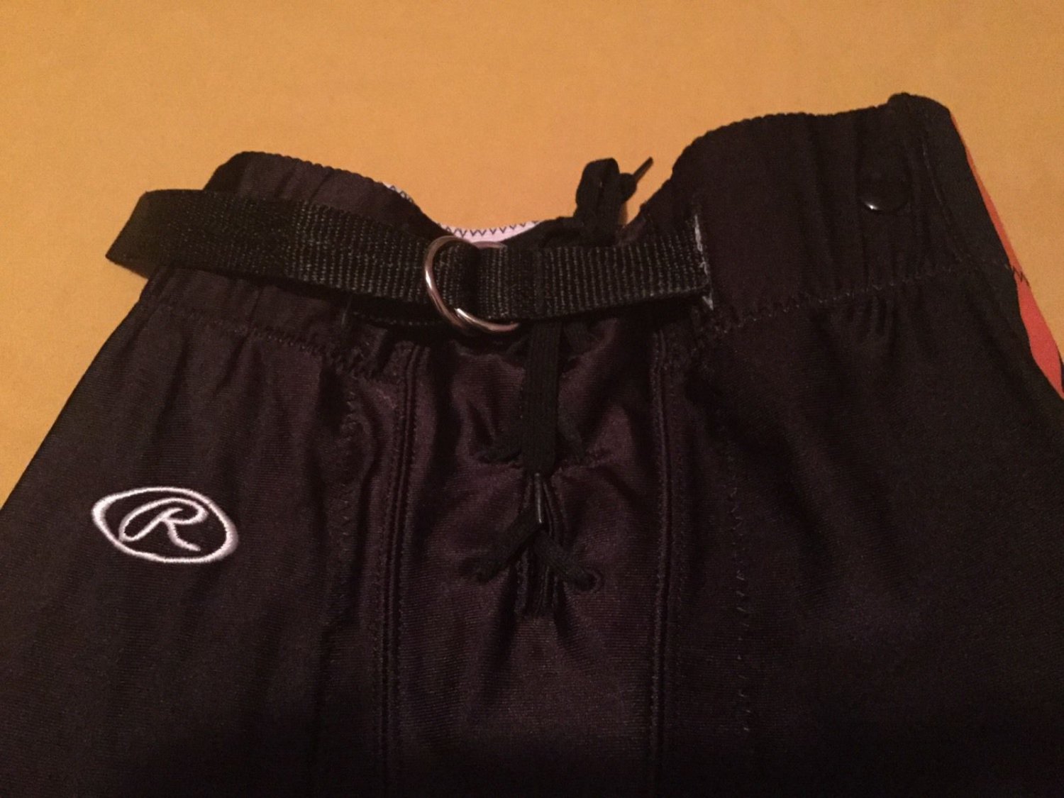 Boys Youth Large Rawlings football pants black orange pipping practice