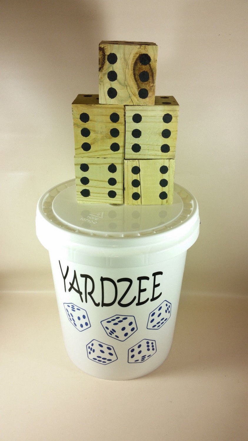 Yardzee oversize dice game outside play with score card bucket
