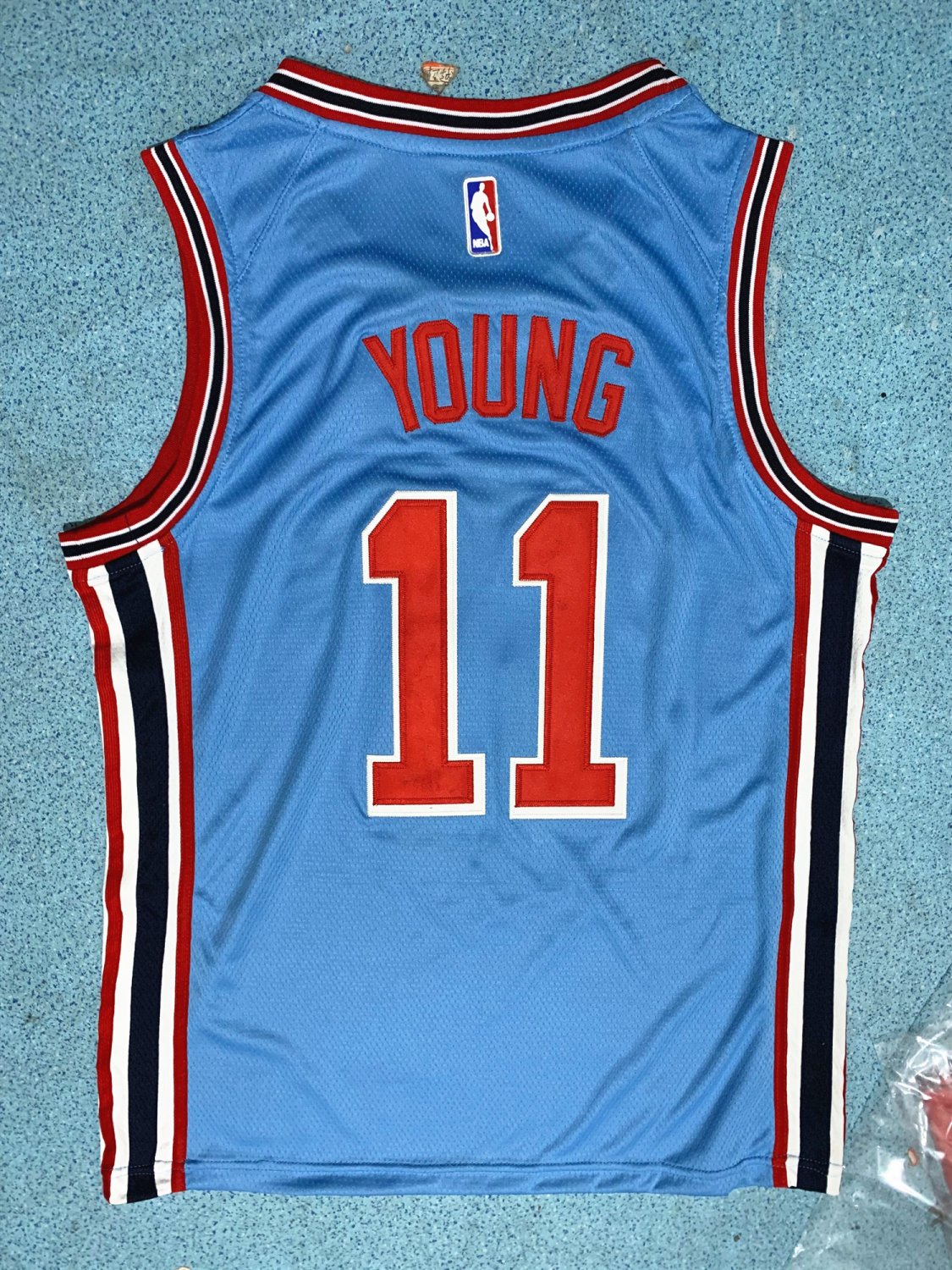 trae young light blue jersey
