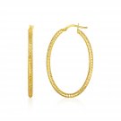 14k Yellow Gold 1.41" Long x 0.63" Wide Fashionable Textured Oval Hoop Earrings