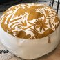 Round gold and off white Otomi pouf