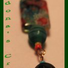 Green Flowers And A Gold Bell
