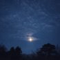 Red moonlight sky. Moon in in white clouds. 2 photos framed. Mathias Zoneu