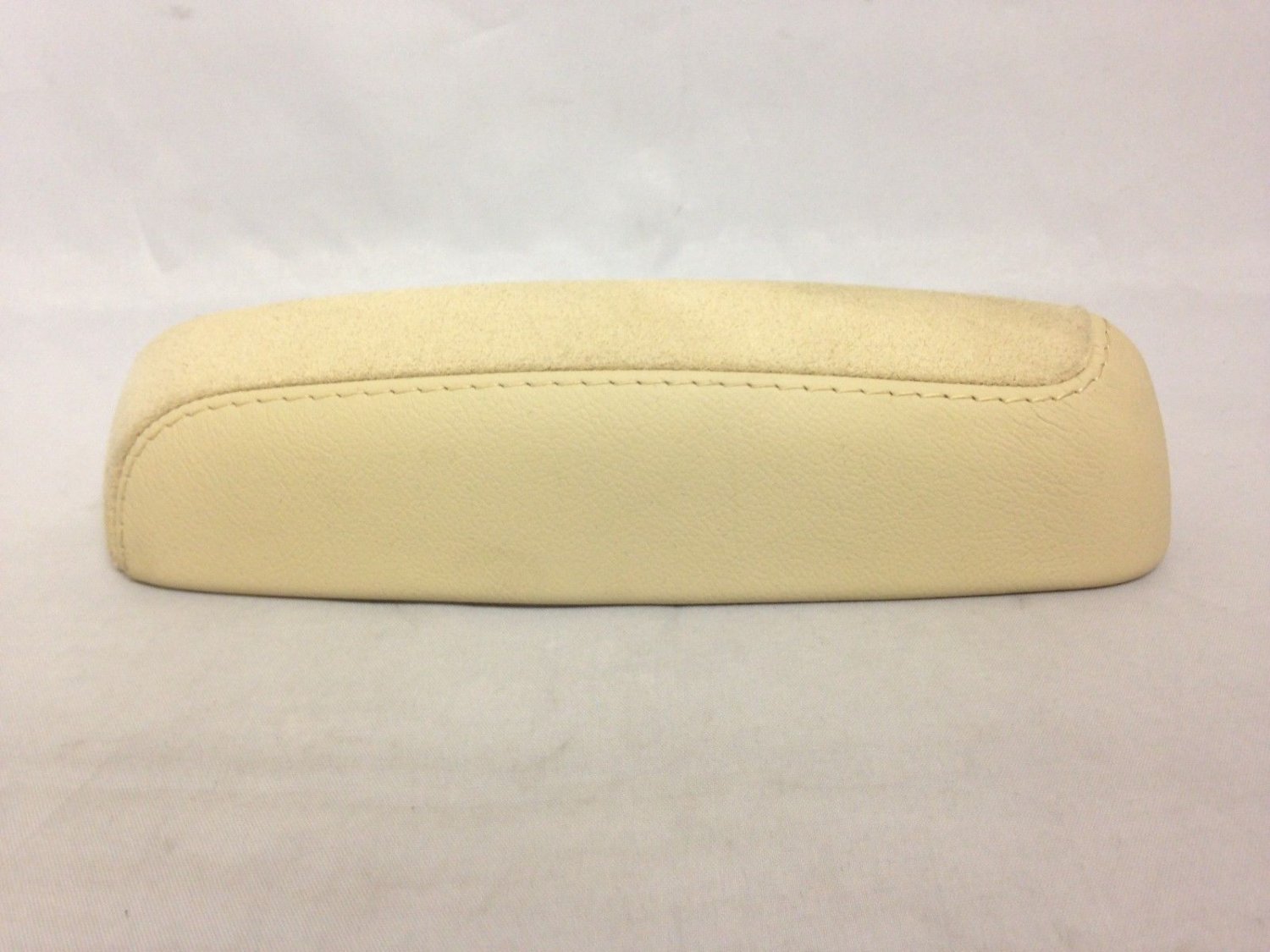 CTS 2014-18 very light cashmere upper end cap. Goes behind lid on center console