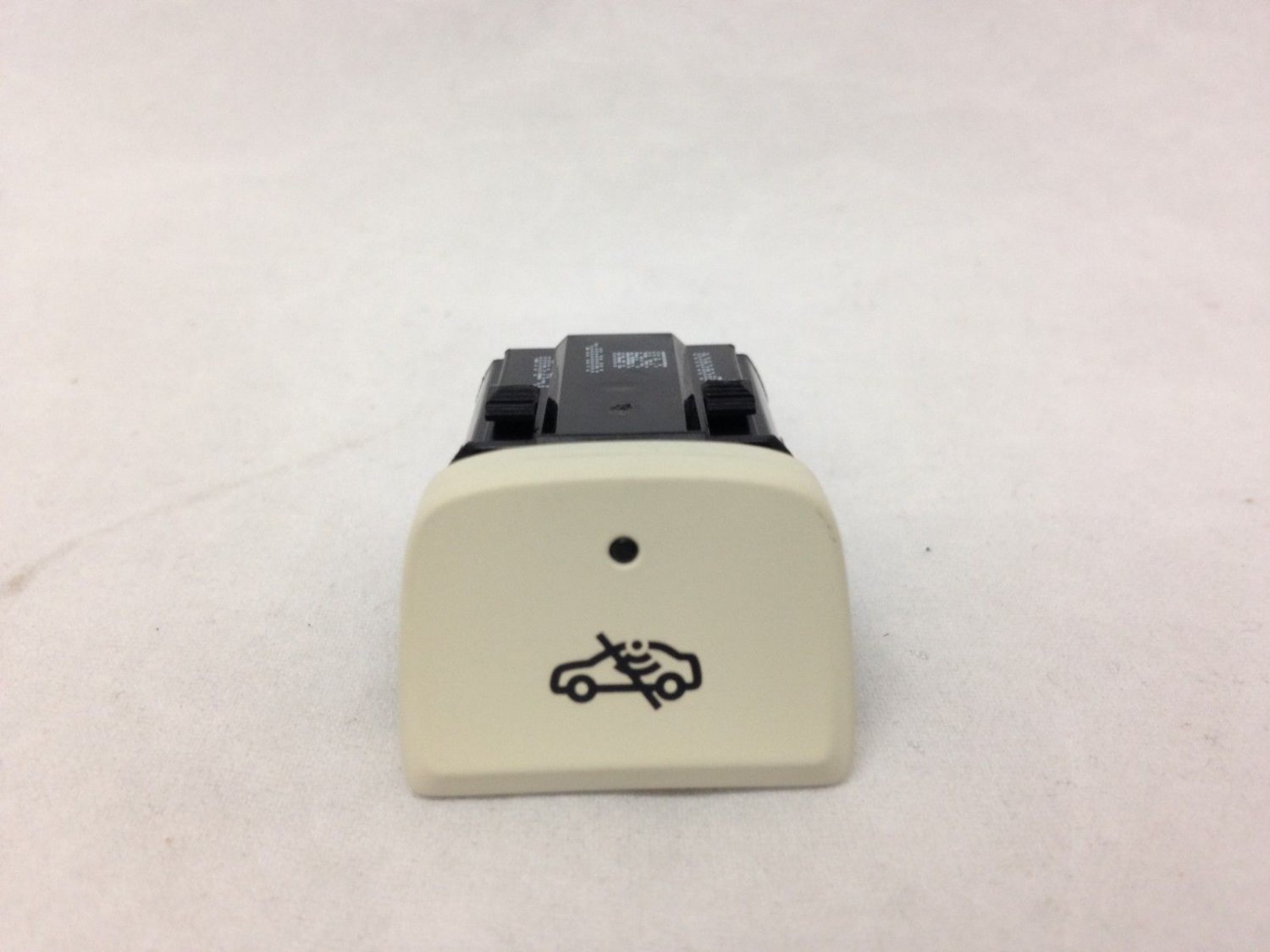GM theft deterrent alarm disable switch. Console mounted. Light Wheat