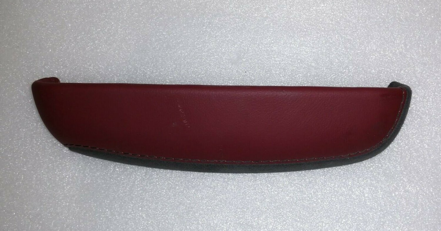 CTS 2014-18 morello red leather upper end hinge cap. Behind lid on console. Blem