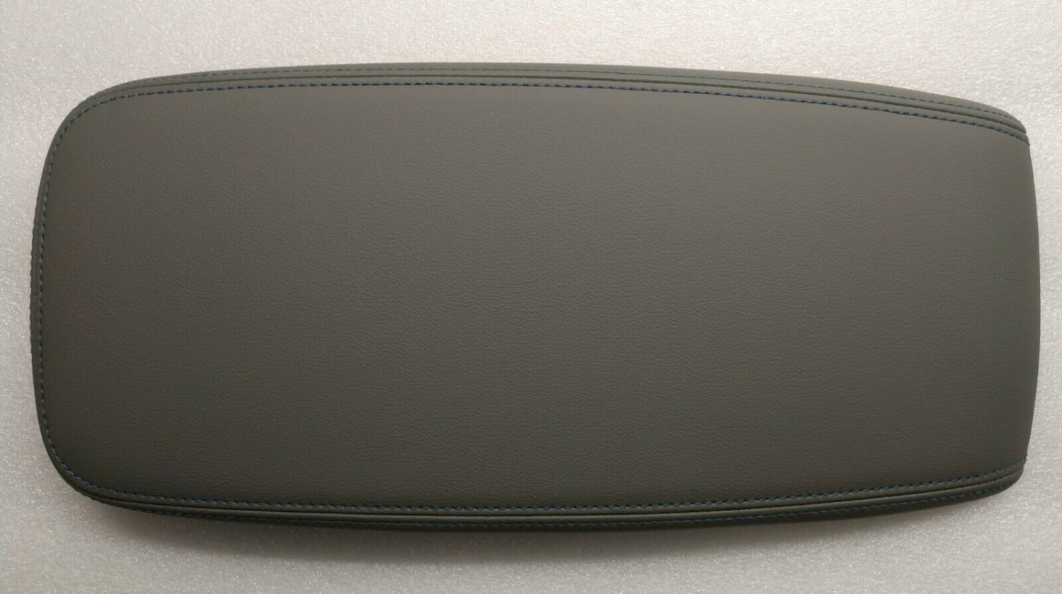 Volt 2016-2019 gray leather center console lid armrest. Blue stitching. OEM New