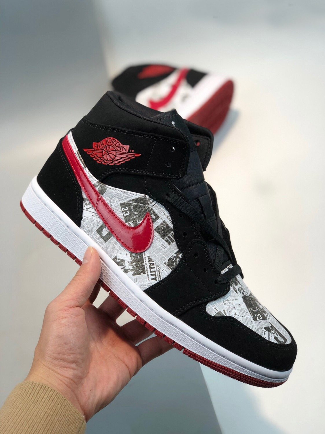 jordan 1 red and black newspaper