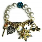 Faux Pearl And Teal Shamballa Bead With Key Heart Bow Starburst Charm Bracelet