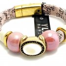 Pink And Black Strap Bracelet With Pink Beads And A  White Oval Center Stone
