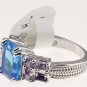 Size 7 Fashion Ring With Radiant Cut Blue Center Stone And Purple Accents