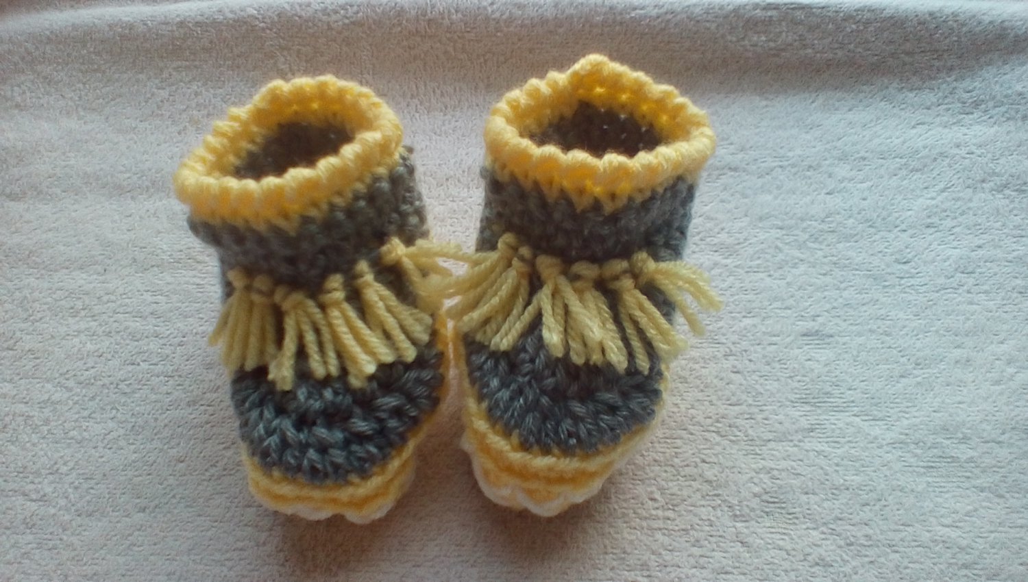 Newborn two toned yellow,and gray moccasins