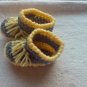 Newborn two toned yellow,and gray moccasins