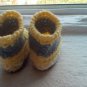 Newborn two toned yellow,and gray moccasins